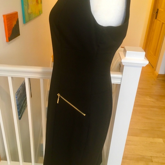 Lovely Calvin Klein black fitted dress, with gold accent pockets. - Picture 5 of 16